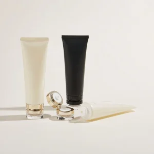 Gold Trim Transparent Base Cap Cosmetic 5 Layers Tube with Acrylic Golden Flip Cap Custom Logo for Facial Cleanser Cream